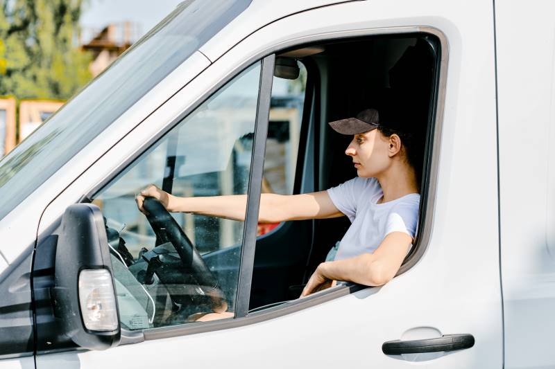 young-woman-driving-a-van Freight specialists Melbourne